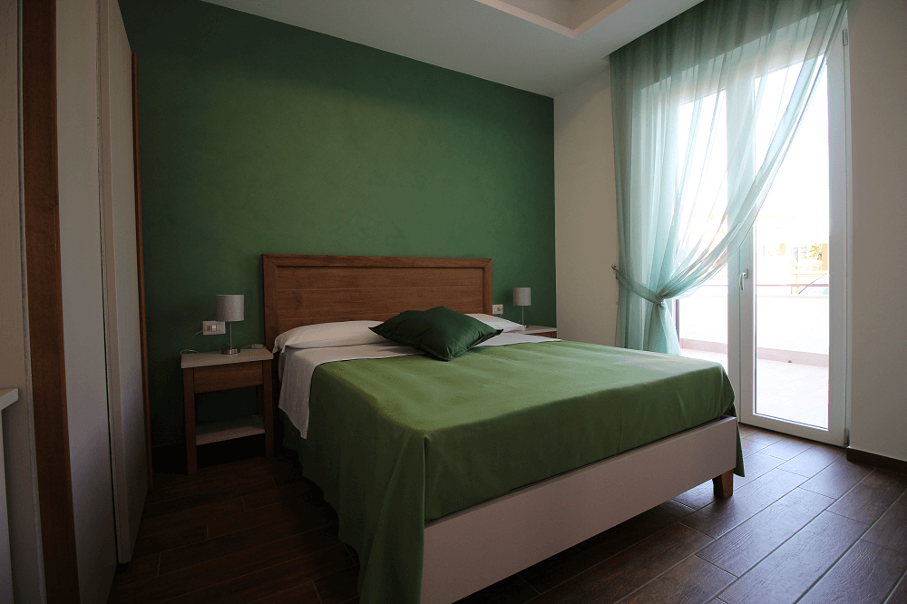 camera-matrimoniale-accessibile-letto.png